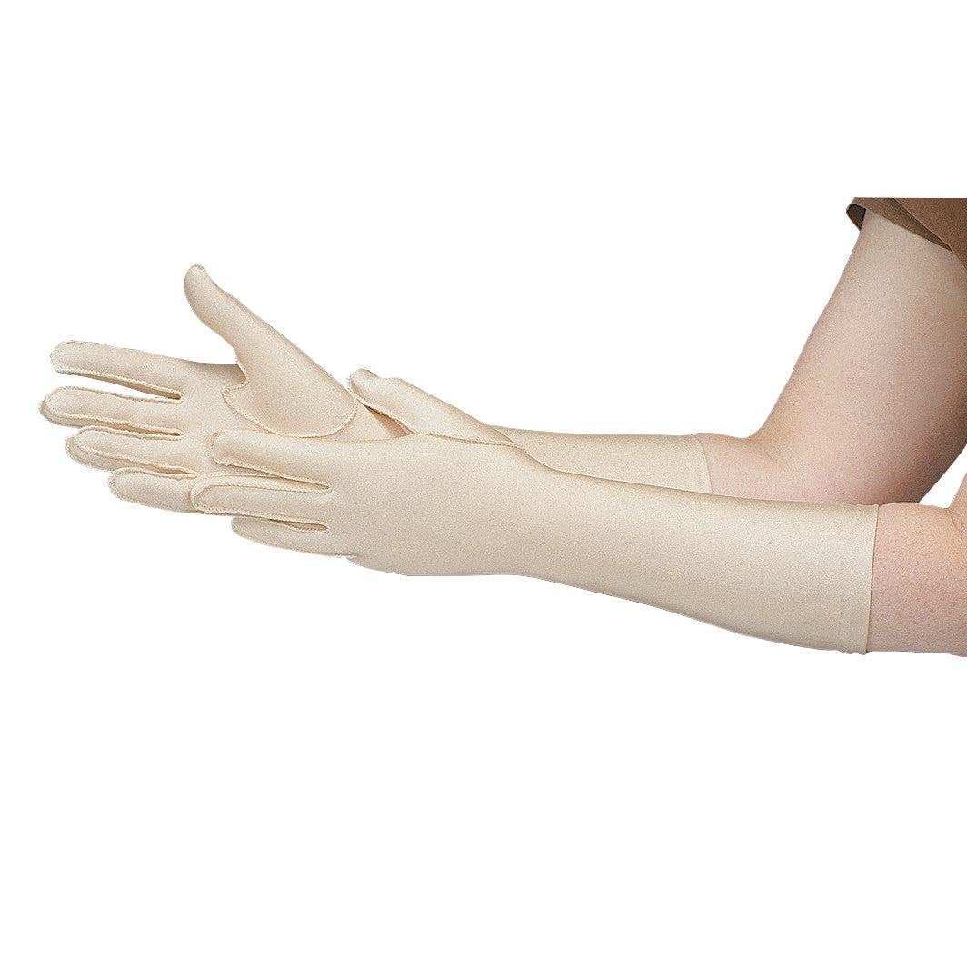 A person wears a Full-Finger Forearm-Length Gentle Compression Glove, beige in color, covering from fingertips to forearm.