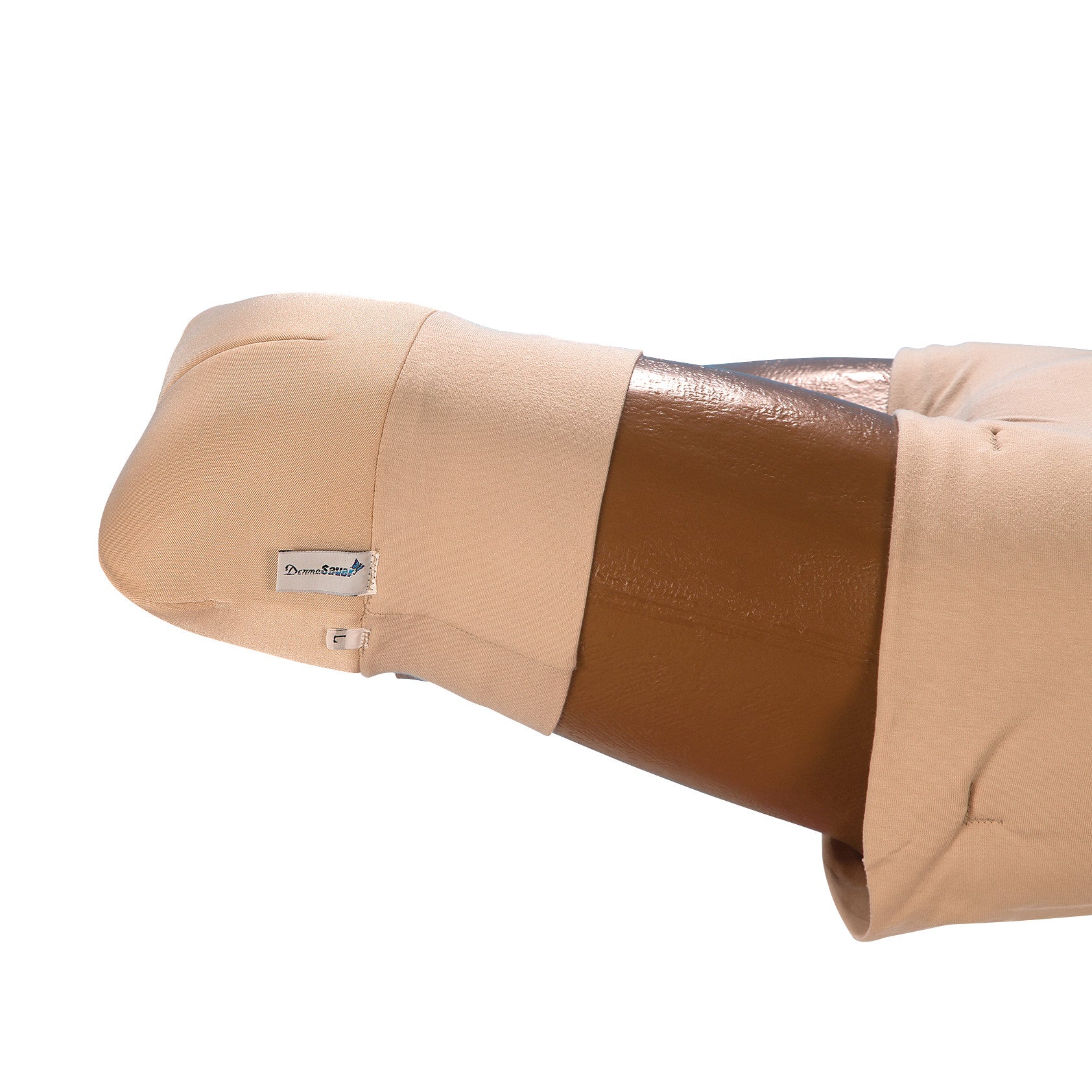 A brown cylindrical object is wrapped in a beige DermaSaver Amputee "Stump" Cover with a visible tag on its side.