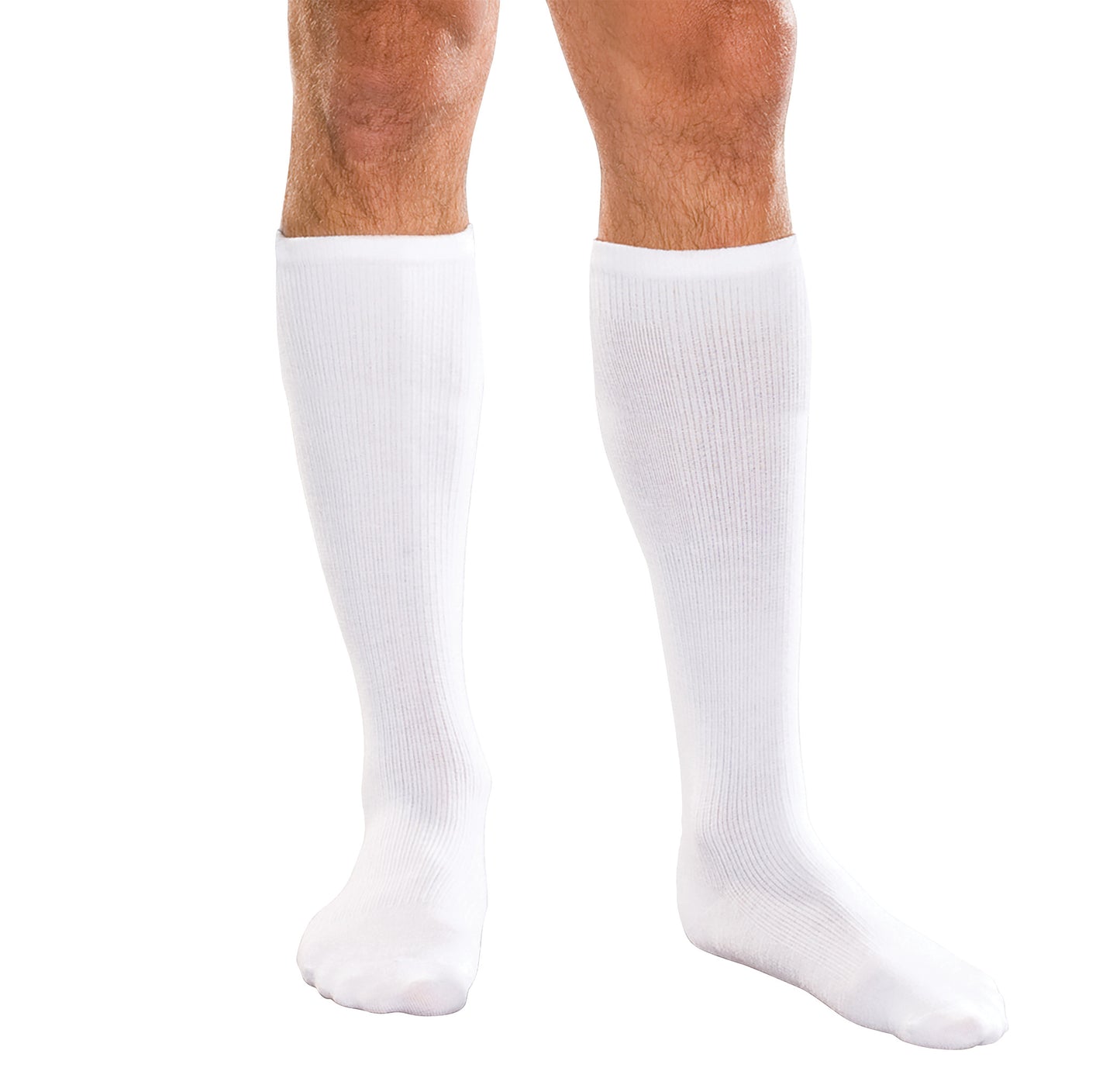 A person wears white Core-Spun by Therafirm Support Socks, extending to just below the knees, against a white background.