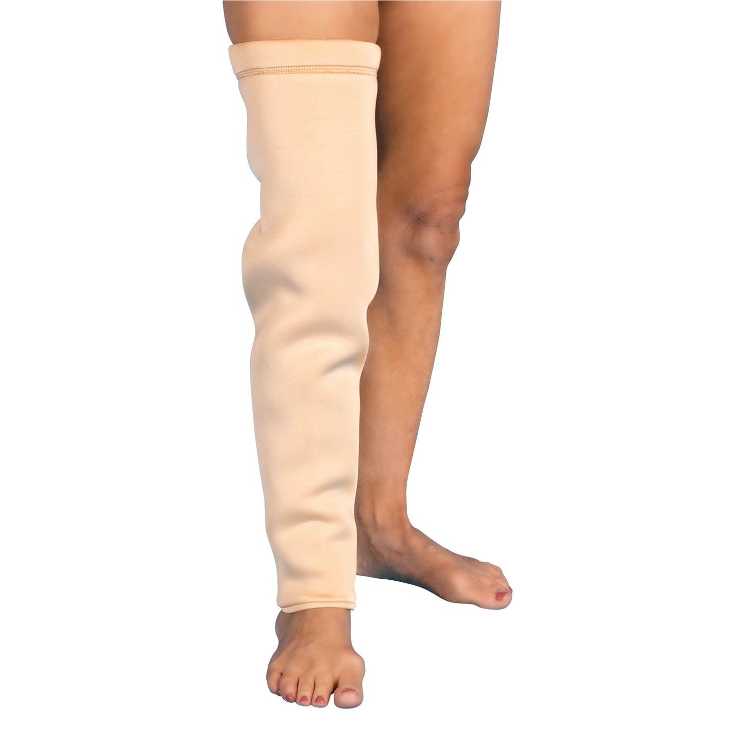 A person's leg wearing a DermaSaver Full Leg Tube, a beige fabric sleeve covering the entire left leg up to the thigh.