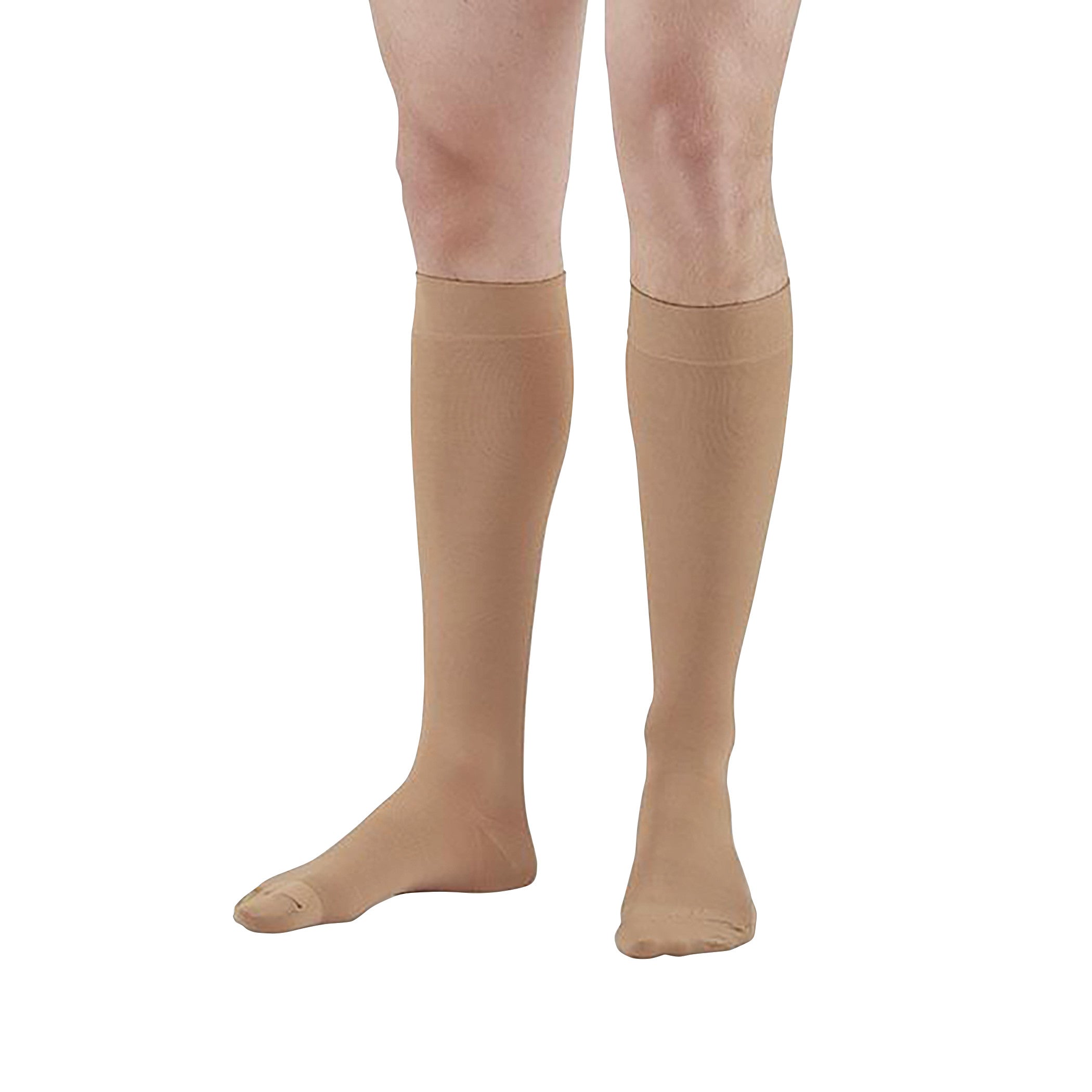 A person wears beige Ames Walker Closed Toe Medical Support Stockings that extend to just below the knees.