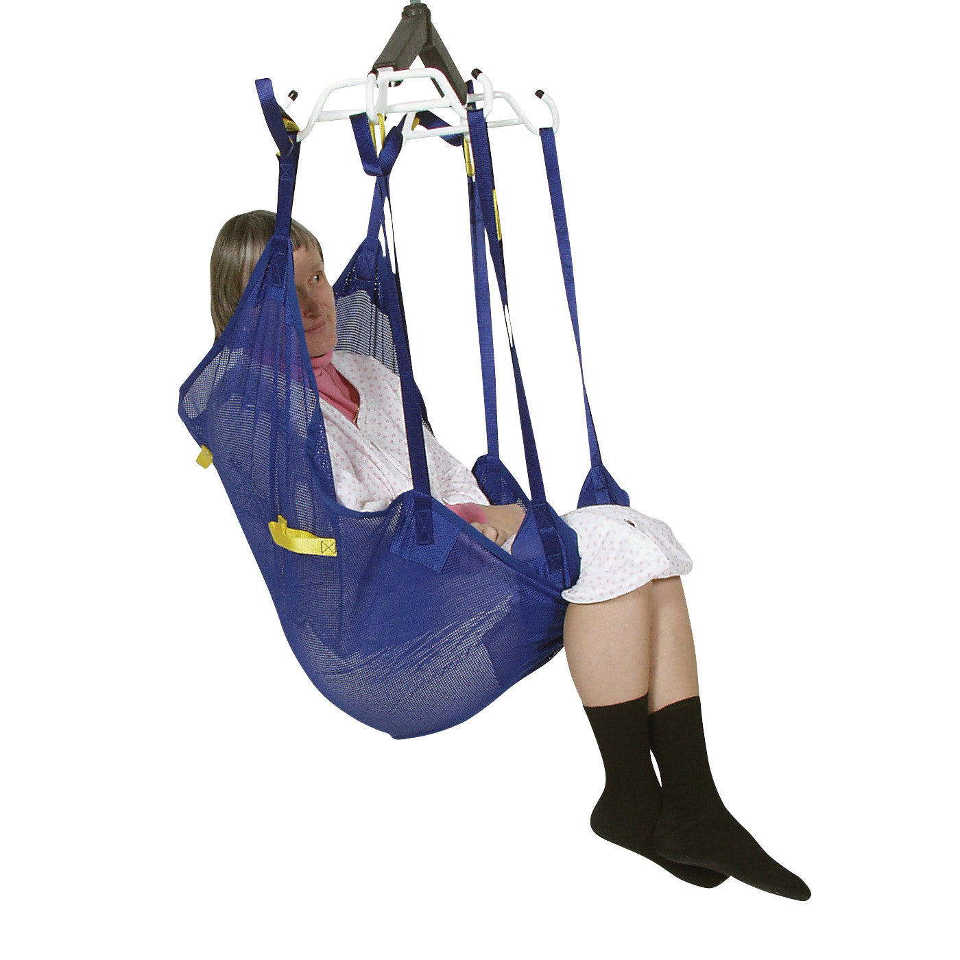 A person wearing pajamas is seated in a blue Bestcare BestSling Universal Patient Sling, suspended for lifting assistance.