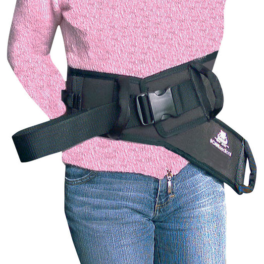 A person wearing a "SafetySure Transfer Belt," featuring a black buckle, straps, and support handles. The belt is worn over jeans.