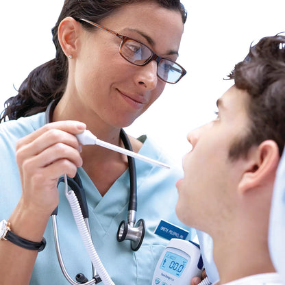 A healthcare professional uses the Welch Allyn SureTemp Plus 692 Electronic Thermometer to take a patient's temperature orally.
