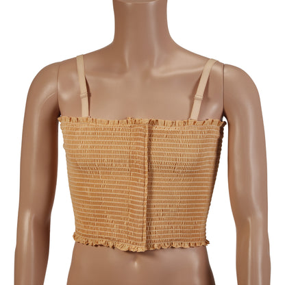 A mannequin wears the Expand-A-Band Lined Breast Binder. It's a beige, shirred crop top with adjustable straps, 12 per pack.