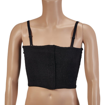 A mannequin wears an Expand-A-Band Lined Breast Binder, which is black with adjustable straps and a textured fabric.