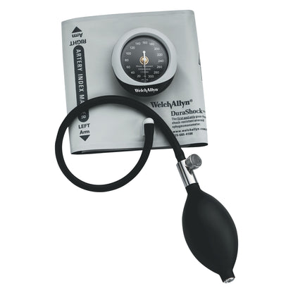 A Welch Allyn Tycos DuraShock Integrated Aneroid with gray cuff, black bulb, and dial gauge for measuring blood pressure.