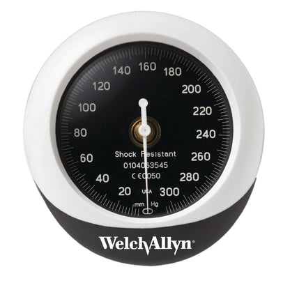 Welch Allyn Tycos DuraShock Integrated Aneroid, a round gauge with a black face and white numbers, measuring blood pressure in mmHg.