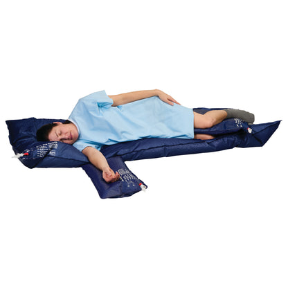 A person is lying on the AliMed Universal Bean Bag Positioner, wearing a blue gown. The blue positioner supports their body.