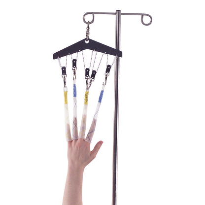 A hand is supported in Allen Equalizer finger traps, suspended from a metal IV pole, using clips and straps for stabilization.