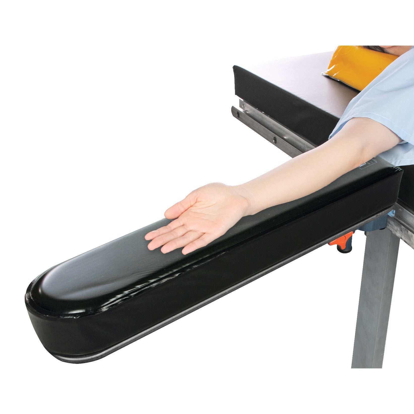 A person's arm rests on the AliMed Gel Composite Armboard Pad, which is black with a soft, cushioned surface, attached to a table.
