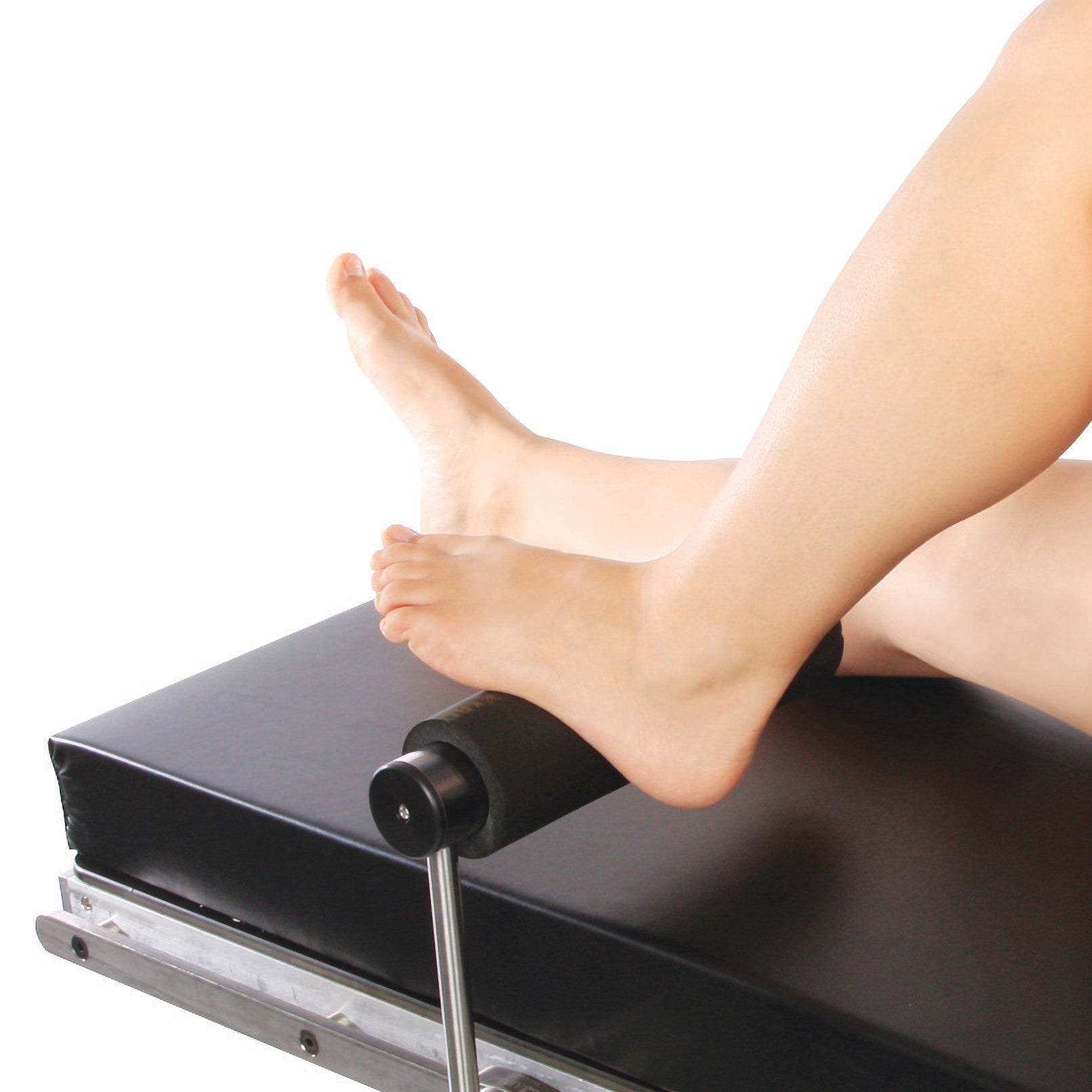 A person's legs are positioned on a Replacement Pad for AliMed Total Knee Replacement (TKR) Support for exercises or support.