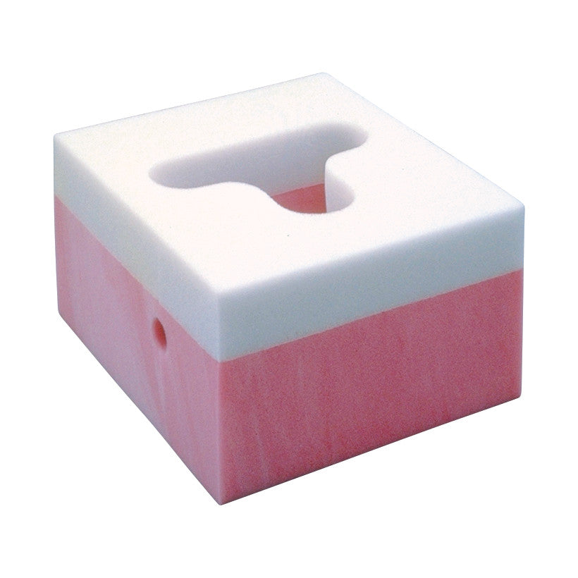 Square foam block with pink and white layers and a cutout labeled Frame Headrest.