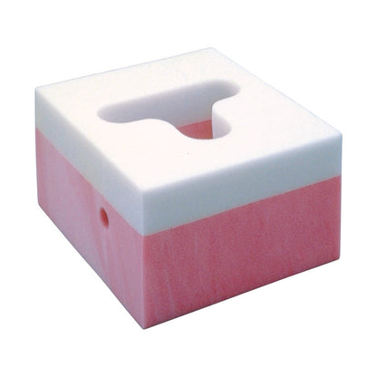 Square foam block with pink and white layers and a cutout labeled Frame Headrest.