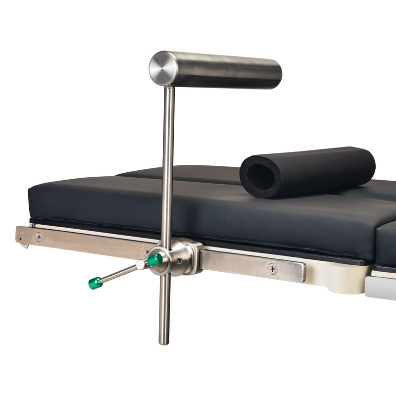 AliMed Stainless Steel Total Knee Replacement (TKR) Support attached to a padded table, featuring an adjustable cylindrical armrest.