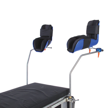 AliMed Lithotomy Stirrup in black and blue, attached to a medical table, used for supporting legs during surgical procedures.