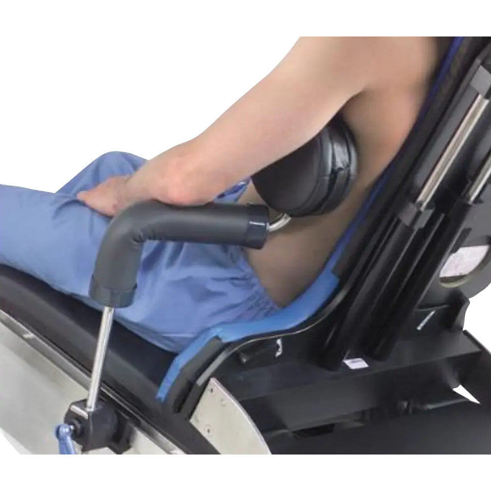 Person seated in an Allen Manual Lift Beach Chair with a Counter Traction Brace, featuring arm and back support.