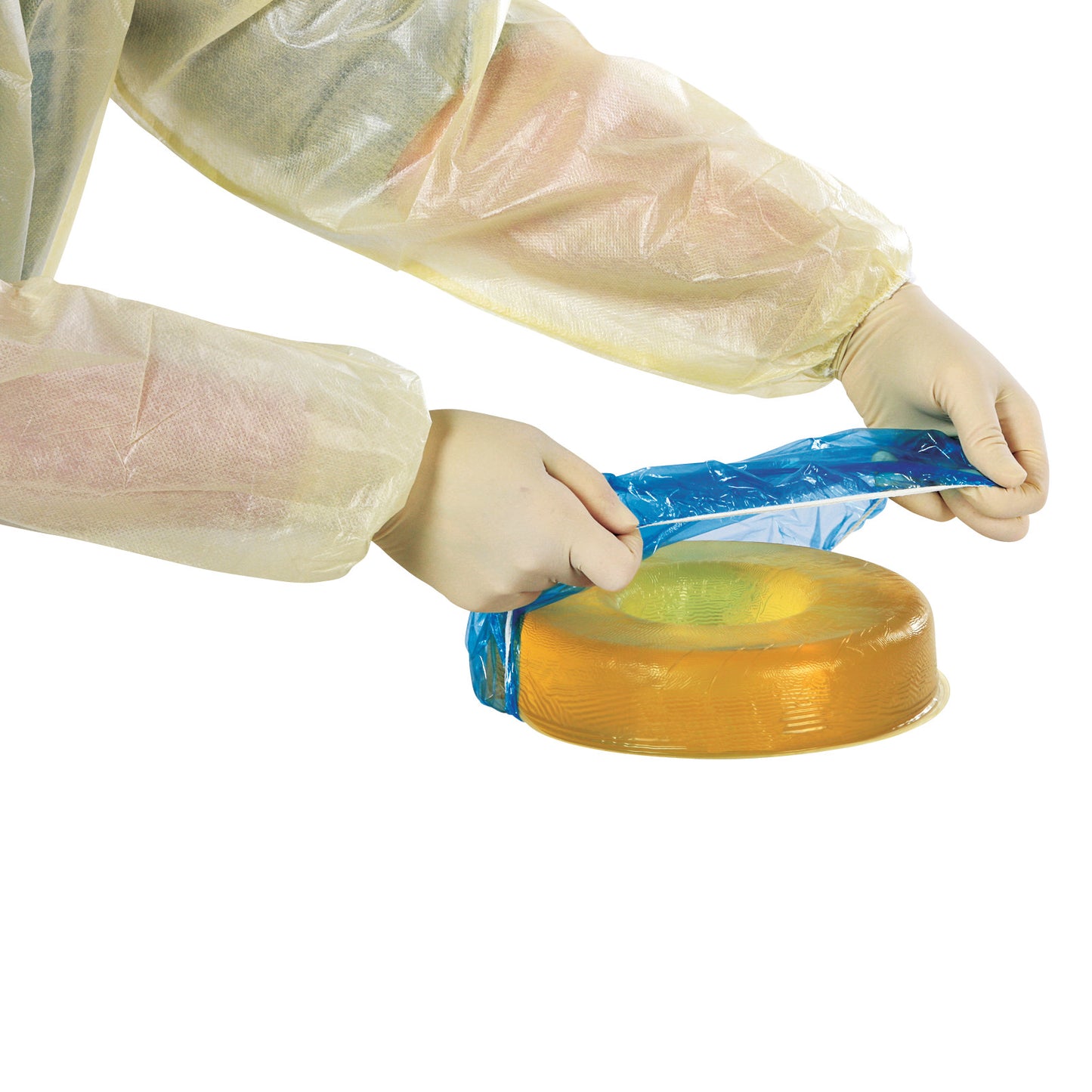 Person in gown and gloves places a blue AliMed Hygienic Donut Cover on a yellow circular cushion for hygiene purposes.