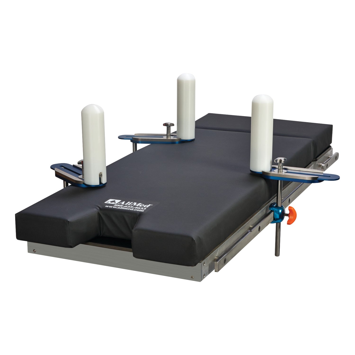 The AliMed Lateral Positioner Set is a medical device with a padded surface and four cylindrical supports for patient stabilization.
