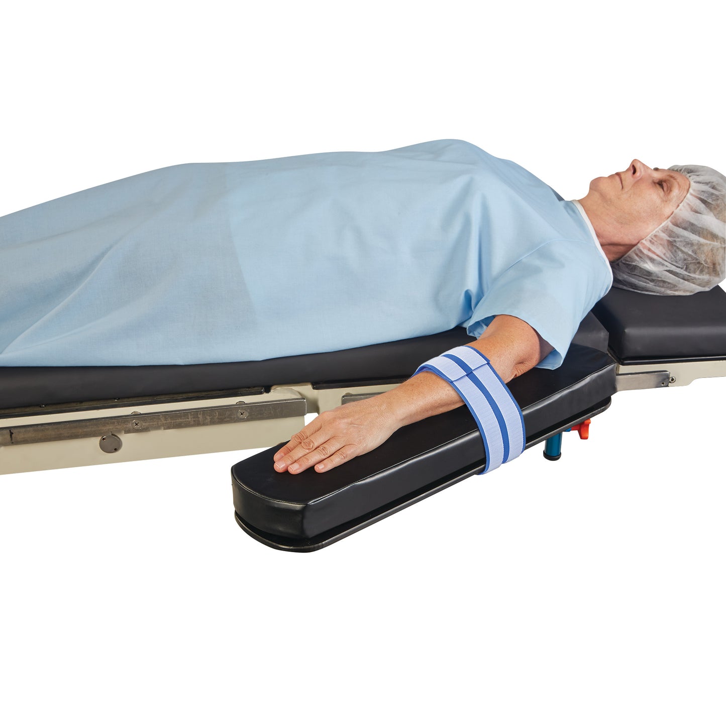 A person lies on a medical table using the AliMed AliStrap Precut Patient Safety Strap to secure their arm.