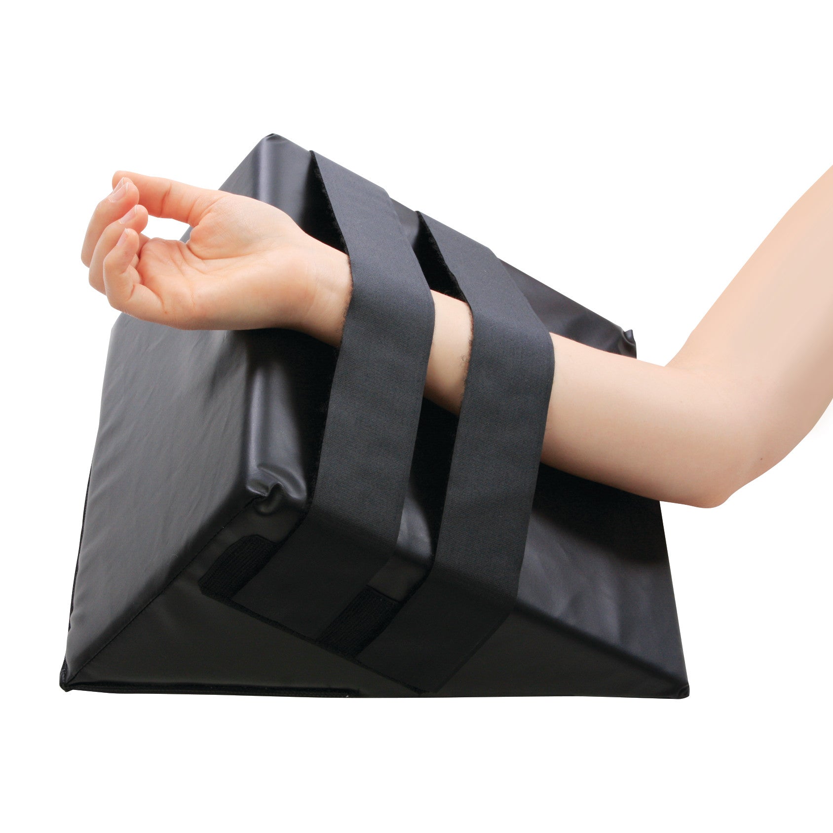 An arm with AliMed Hand and Limb Prepper, a wedge-shaped black cushion with straps, designed for arm and limb stabilization.