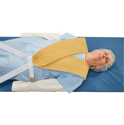 A person lies on a blue mat wearing an AliMed Cervical Visualization Harness, used for medical positioning.