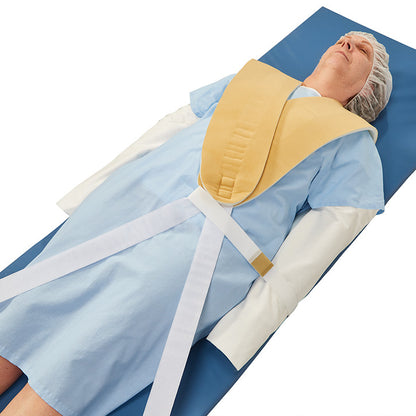 A person on a medical table wearing an AliMed Cervical Visualization Harness, featuring a neck support and straps.