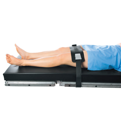 Person secured on a table with the AliMed VeriClean Operating Room Table Strap with Mid-Panel across their thighs.