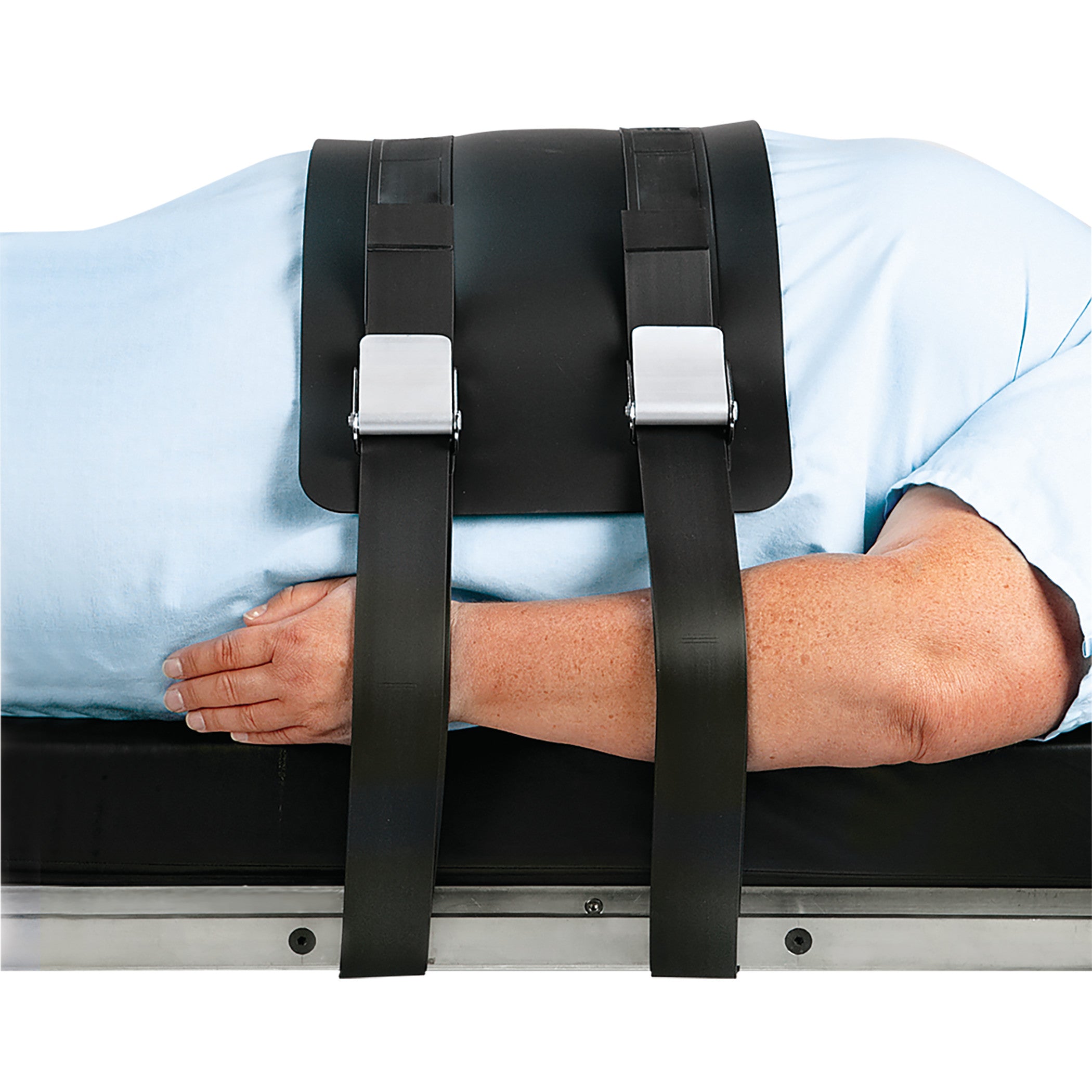A person is lying on a table secured with the AliMed VeriClean Bariatric Operating Room Table Strap with Mid-Panel.