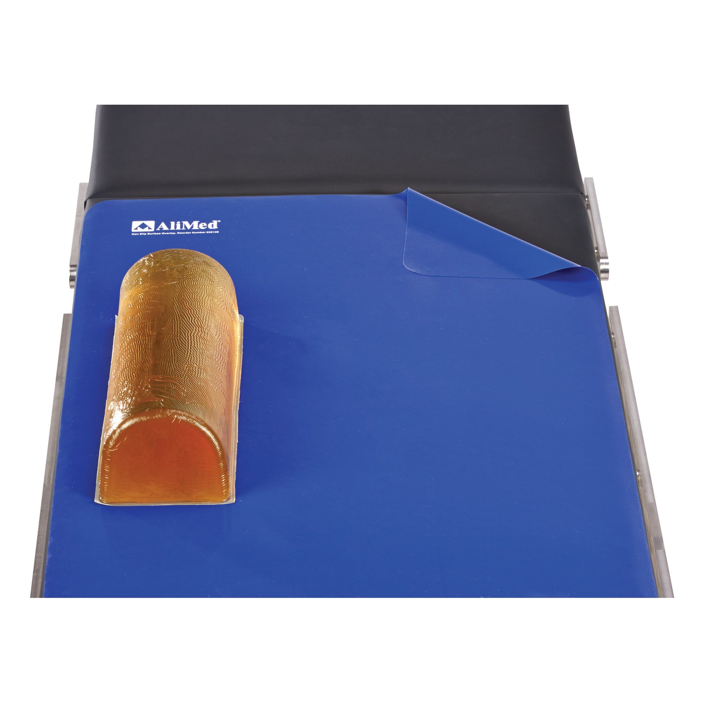 AliMed Nonslip Surface Overlay on an exam table with a small amber gel pad on top, featuring a blue and black color scheme.