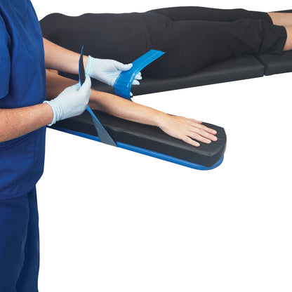 A person secures an arm with an AliMed AliBlue Gel Armboard Strap, designed for comfortable positioning on an armboard.