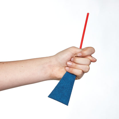 A hand holds the AliMed FREEDOM Palmar Swab Kit, featuring a red handle and a blue triangular sponge tip.