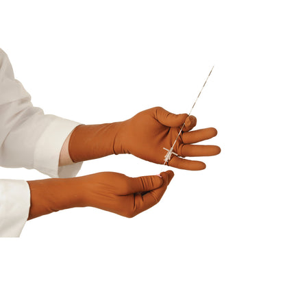 Hands in brown XGuard Radiation Attenuation Gloves holding a thin metal rod against a white background.