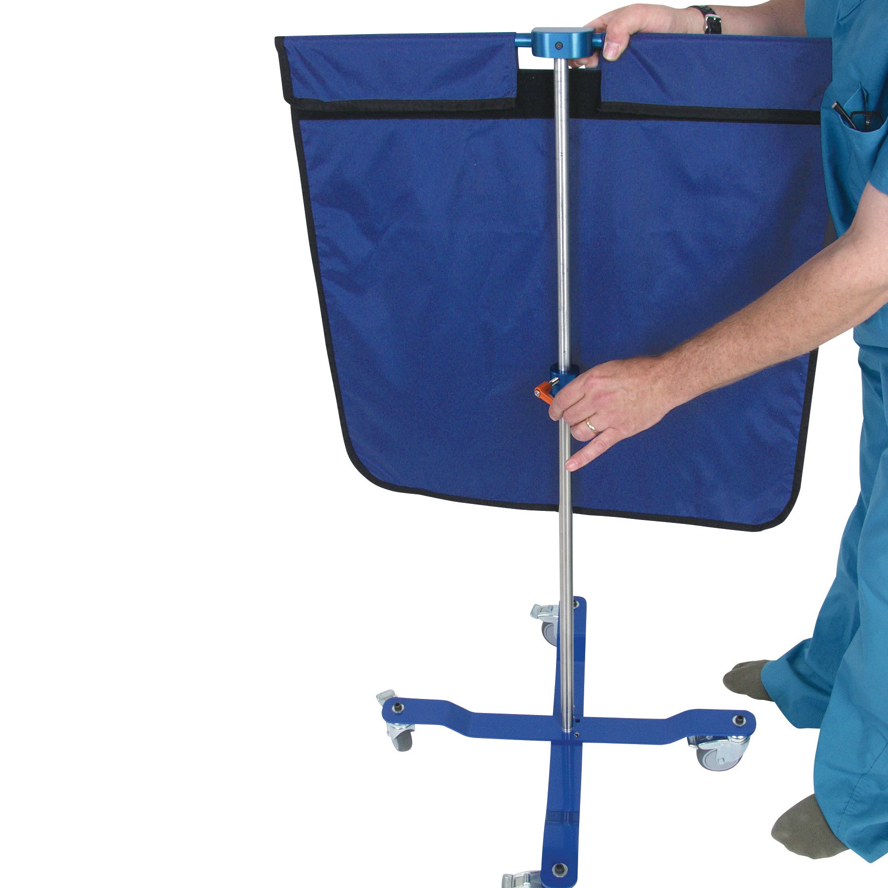 A person adjusts an AliMed Rolling Radiation Shield, featuring a blue fabric panel and a metal frame with wheels for mobility.