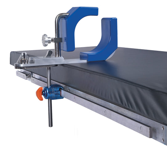 AliMed Fluid-Proof Arthroscopic Leg Holder with a blue U-shaped support attached to a black and gray flat medical table.