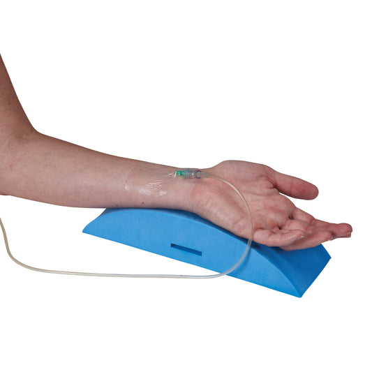 An arm rests on an AliMed Standard A-Line Support Splint, with an IV line inserted. The splint is blue and provides wrist support.