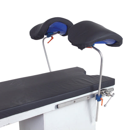 An AliMed Knee Crutch featuring padded knee supports on adjustable metal rods attached to a cushioned medical table.