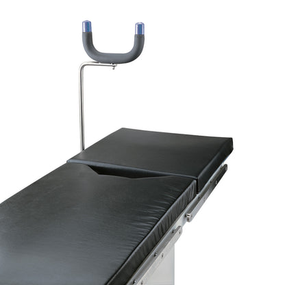 Allen Prepper orthopedic traction pad with a black cushioned surface and adjustable U-shaped support, used on medical tables.