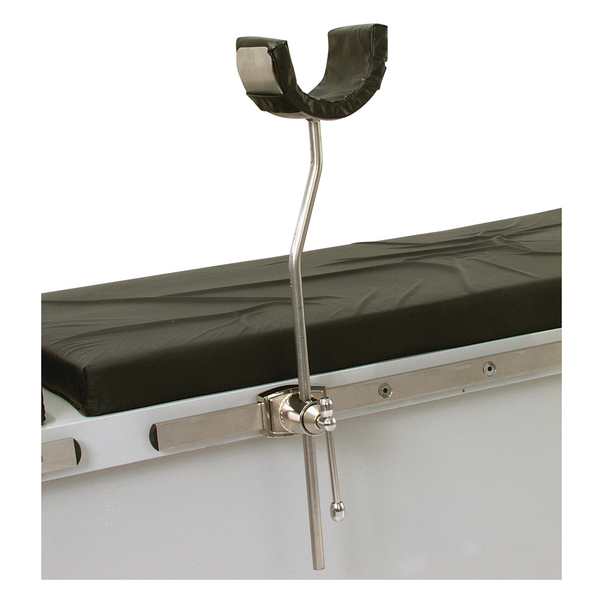 The AliMed Elbow Arthroscopy Positioner is attached to a medical table, featuring a cushioned U-shaped support and a metal arm.