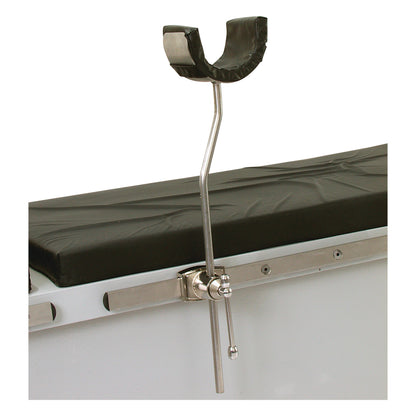 The AliMed Elbow Arthroscopy Positioner is attached to a medical table, featuring a cushioned U-shaped support and a metal arm.