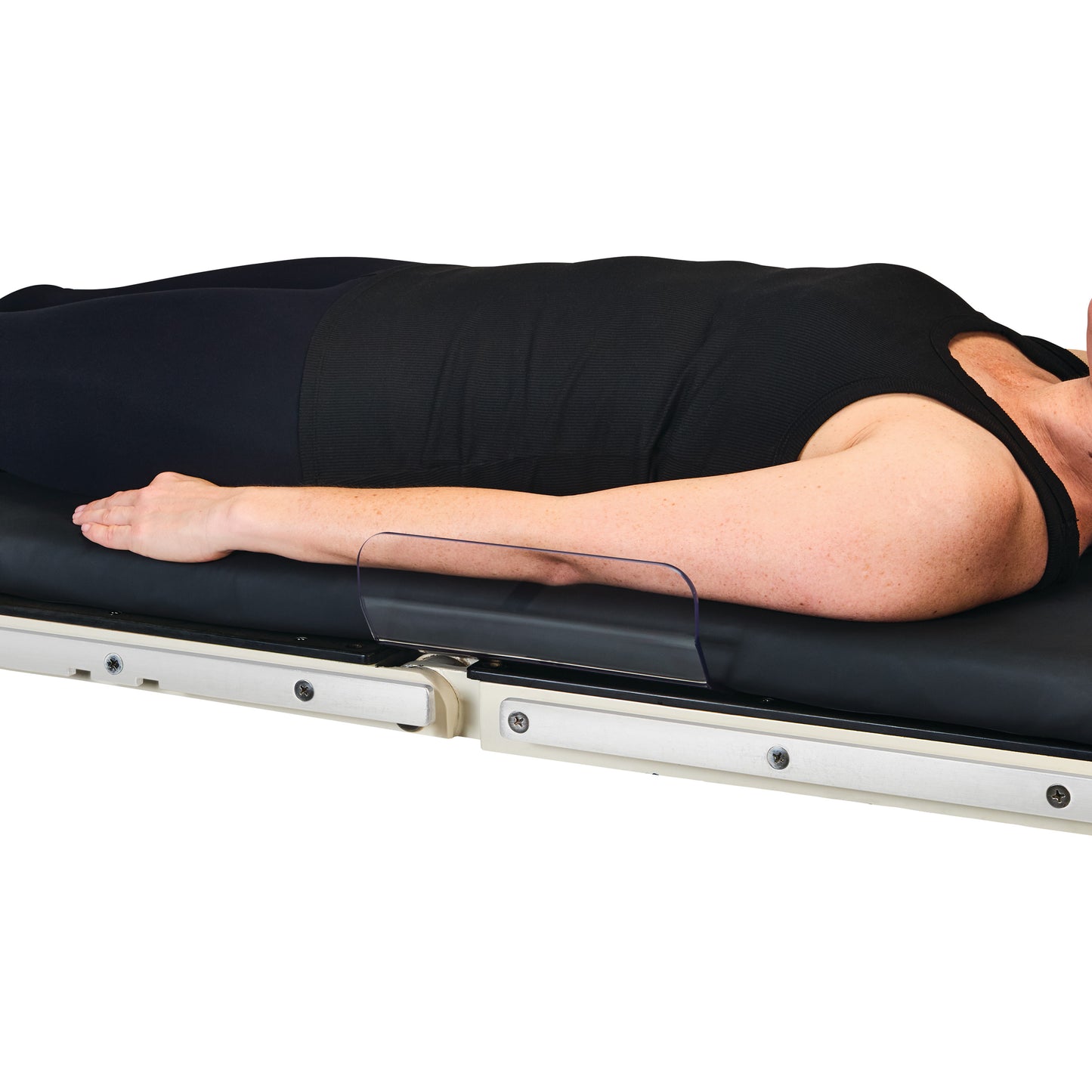 Person lying on a stretcher with the AliMed Low-Profile Toboggan Arm/Leg Guard, positioned to protect the arm.