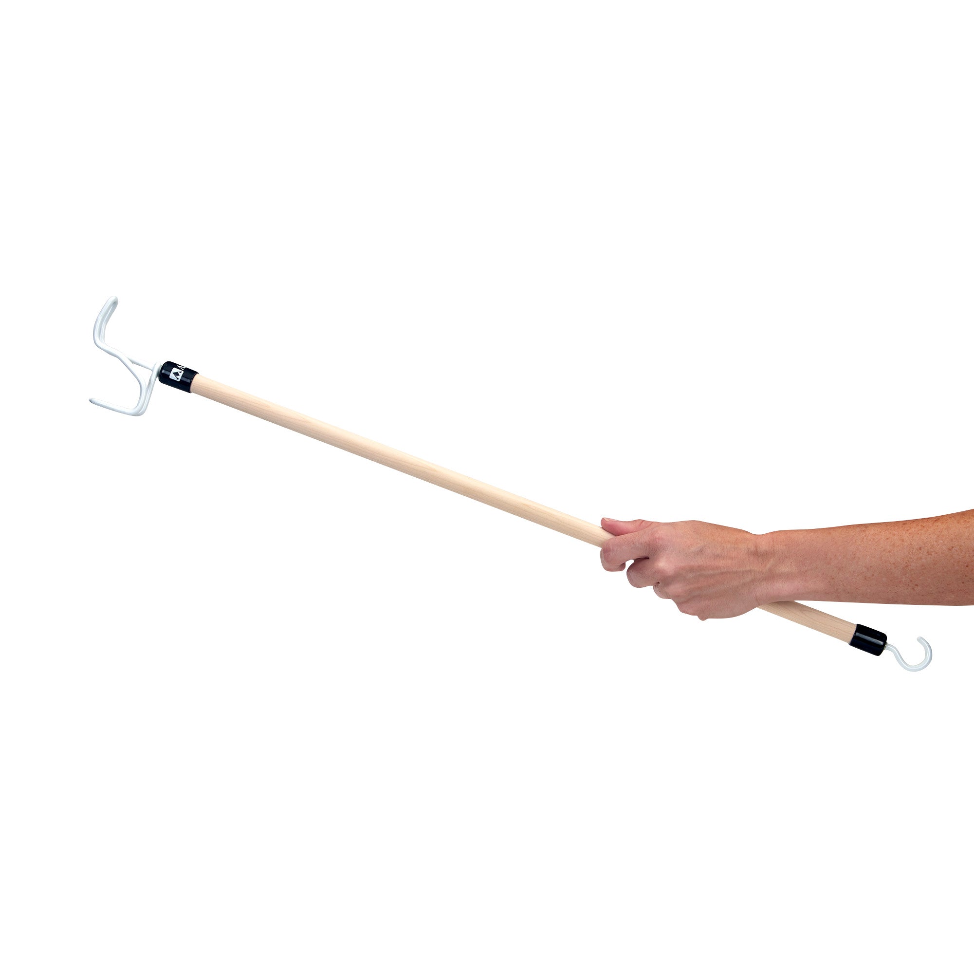 A hand holds a "Big Hook Dressing Stick" with a wooden handle and metal hooks on both ends against a white background.
