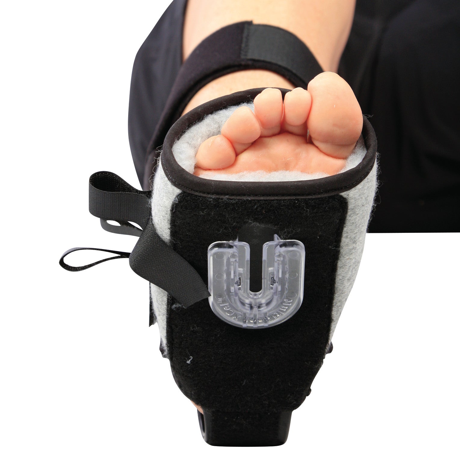 A person wearing an AliMed MultiBoot X-Cel Contracture Boot with Synthetic Fleece Liner, featuring a strap and U-shaped support.