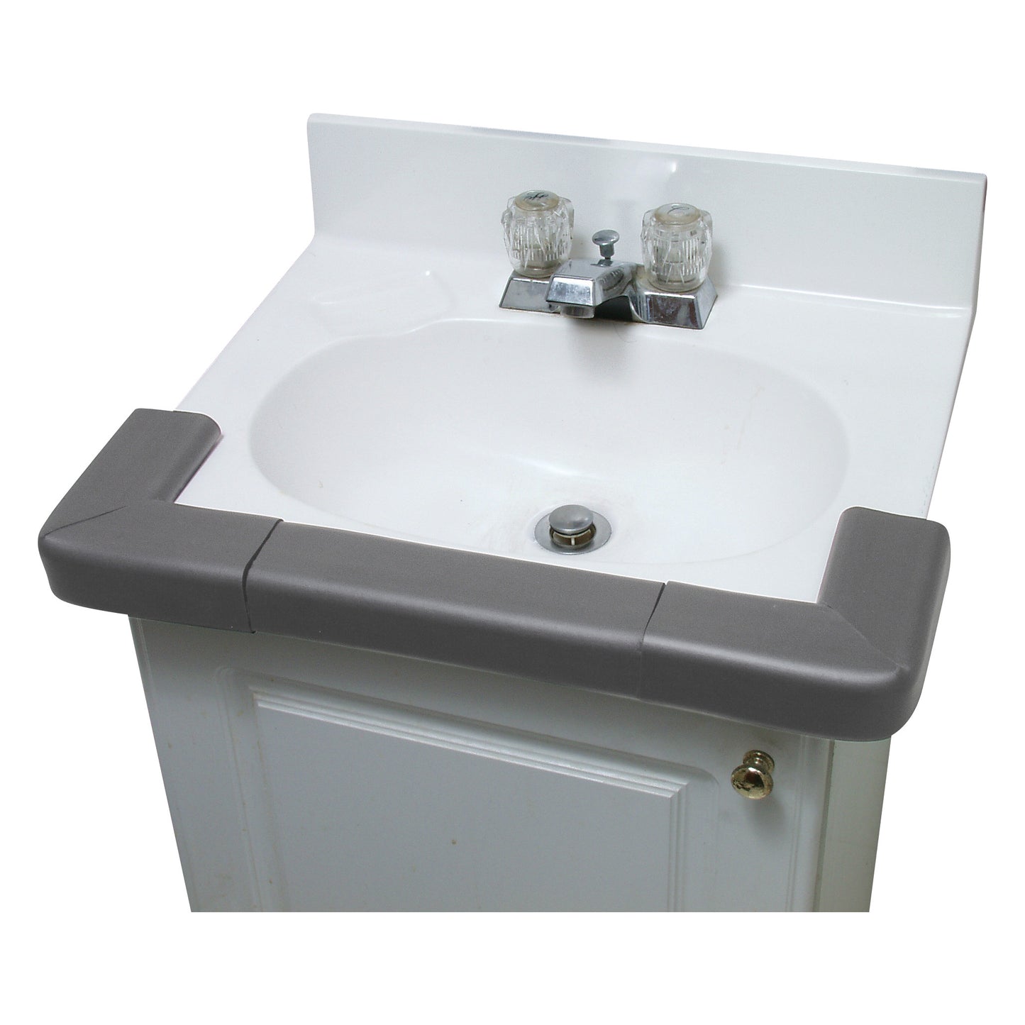 White sink with dual taps, featuring the AliMed SoftEdge Corner Protector in gray along the front edge to prevent injuries.