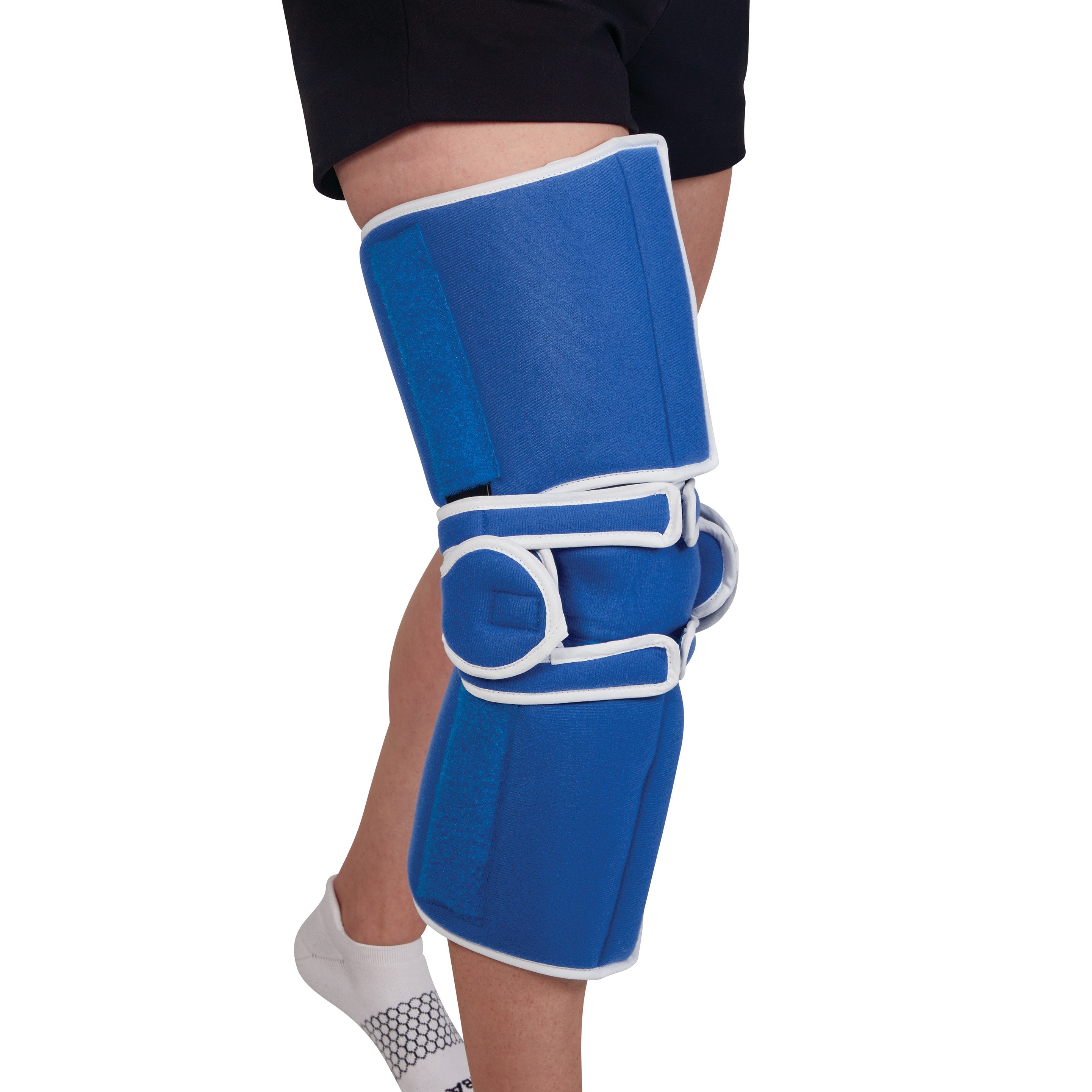 A person wearing an AliMed Easy-On Knee Brace, which is blue with white trim and covers the knee and upper leg.