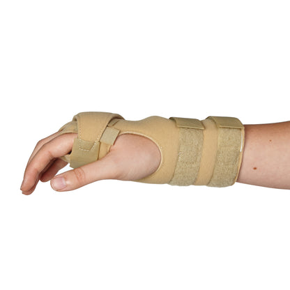A hand wearing an AliMed FREEDOM Arthritis Support, a beige brace with two straps, providing wrist and thumb support.