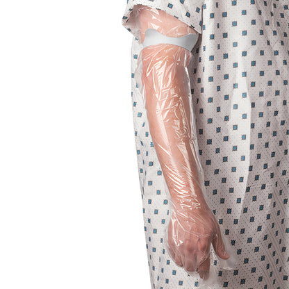 A person's arm wrapped in the Brownmed SEAL-TIGHT Seal Band, a clear waterproof cover, is shown next to a patterned hospital gown.