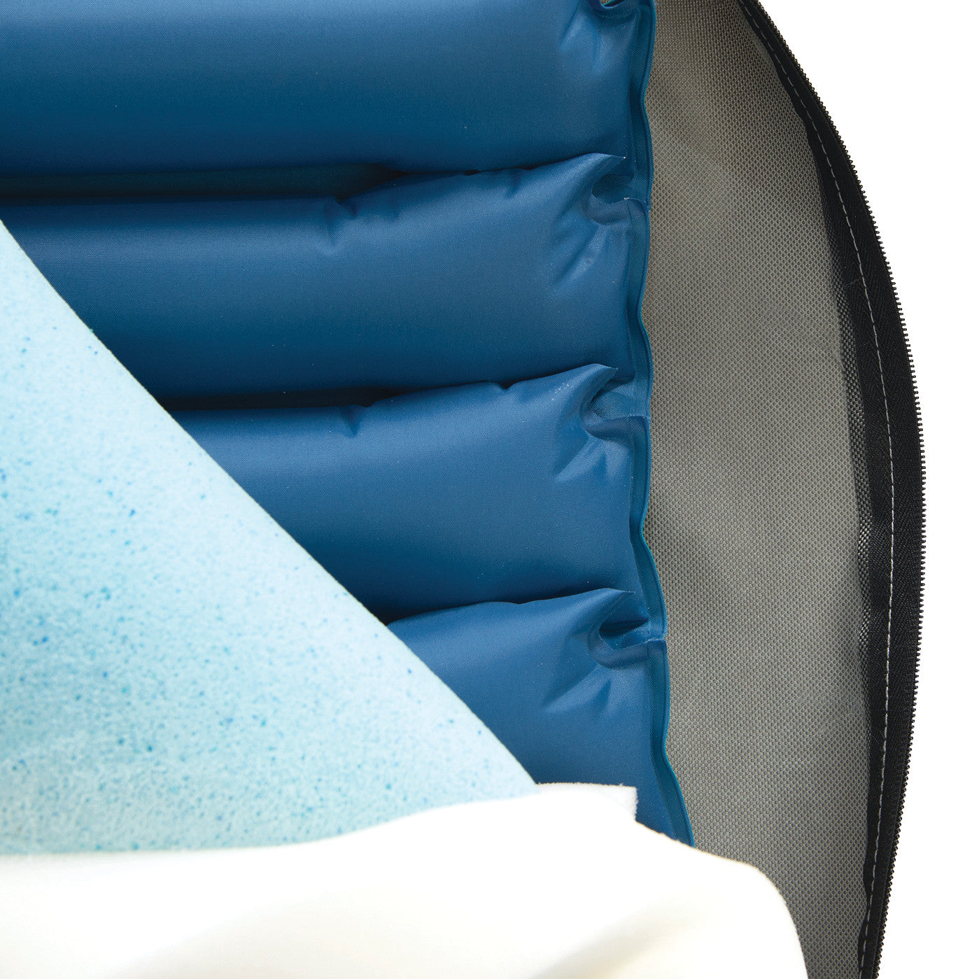 The Protekt Seat Relief System, featuring layered blue foam and inflatable cushions inside a zippered cover.