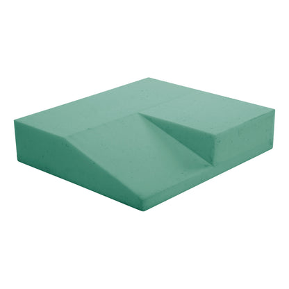 The AliMed AliHip Wheelchair Cushion, Home Model. It is a green cushion with a sloped design for comfort.