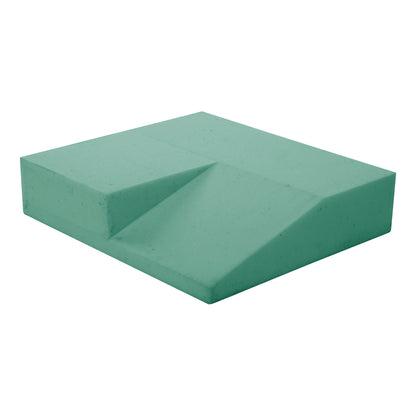 The AliMed AliHip Wheelchair Cushion, Home Model. It's a green, wedge-shaped foam cushion with a sloped design.